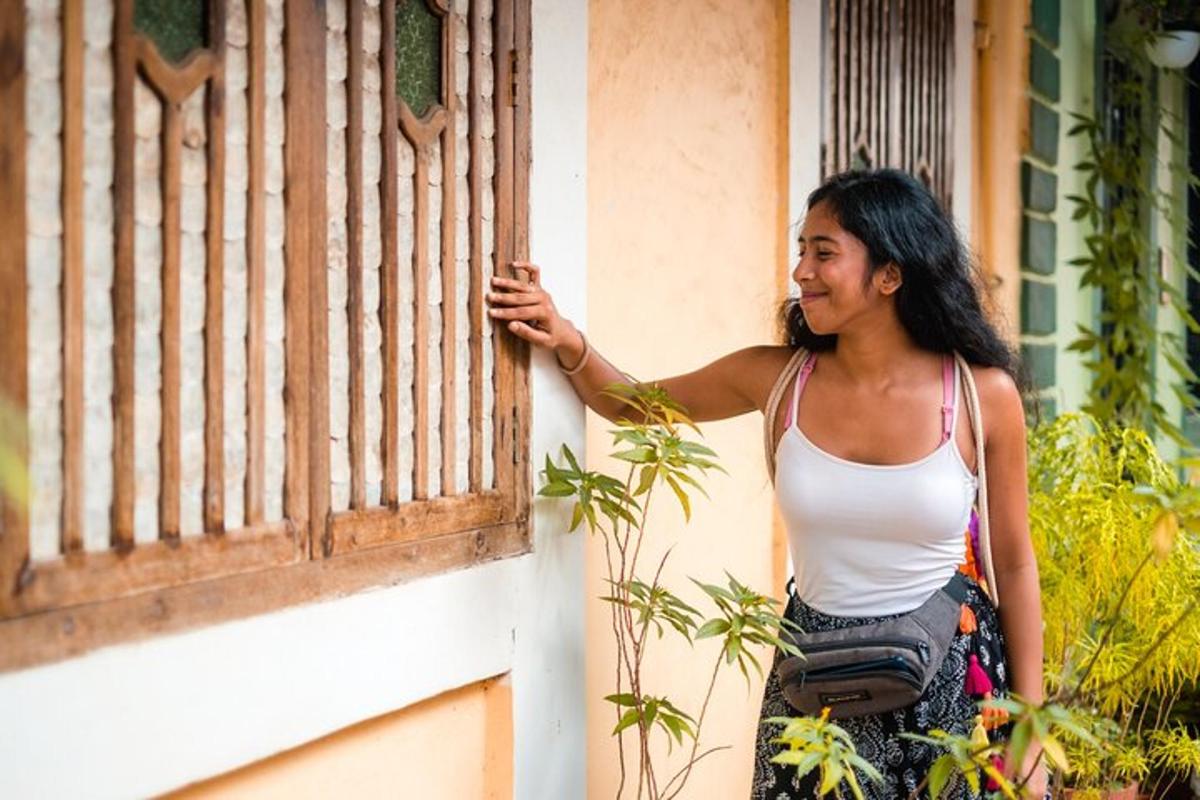 a woman is standing outside of a window