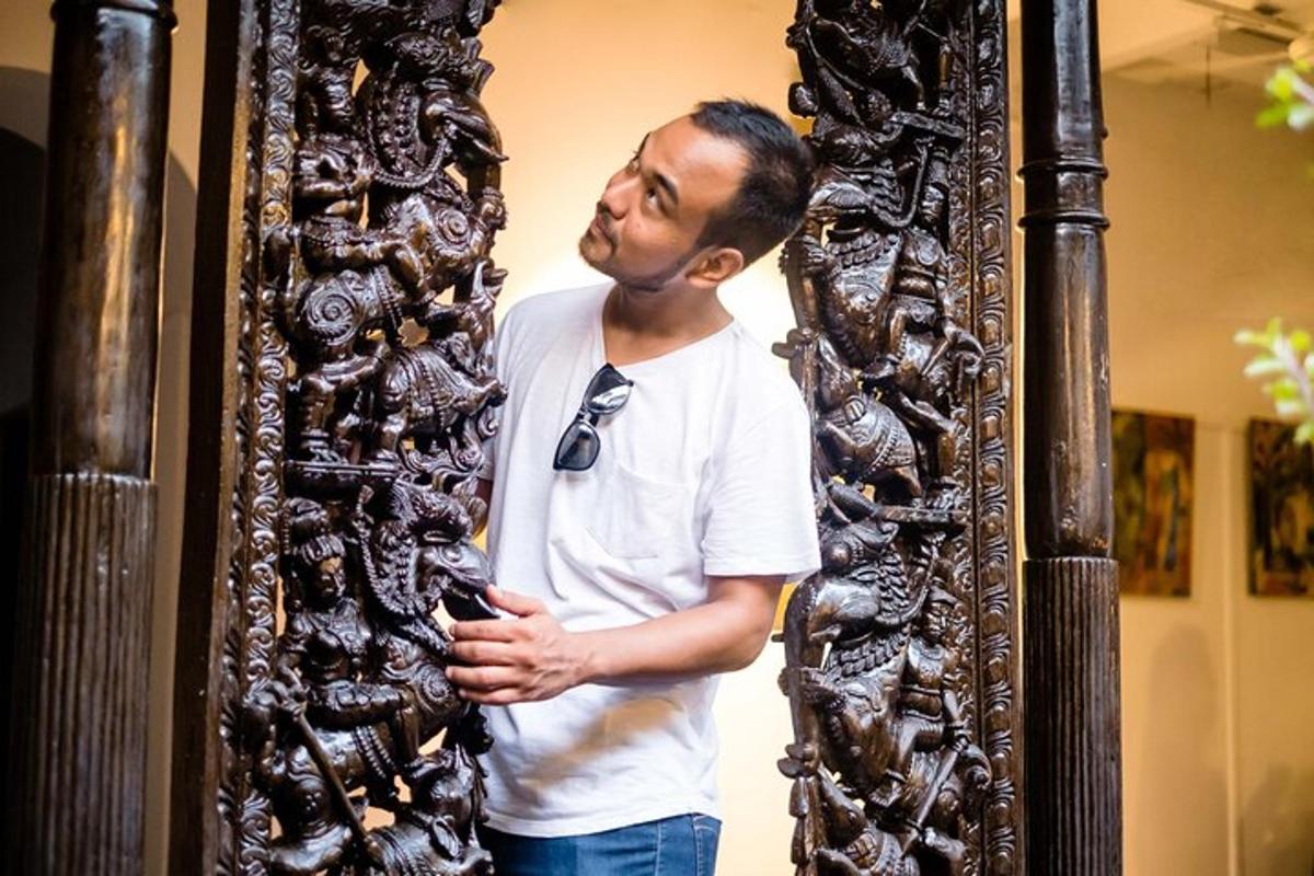 a man is standing next to a mirror