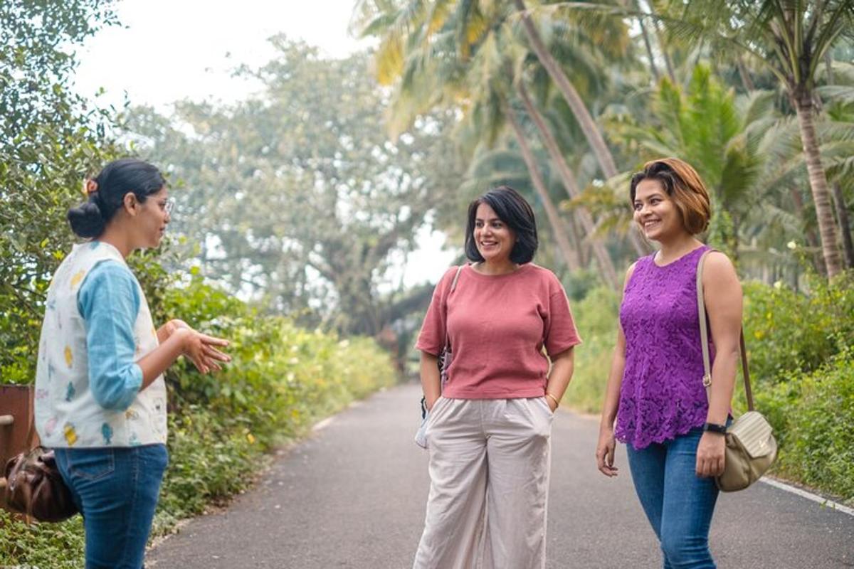 two women walking down a road talking
