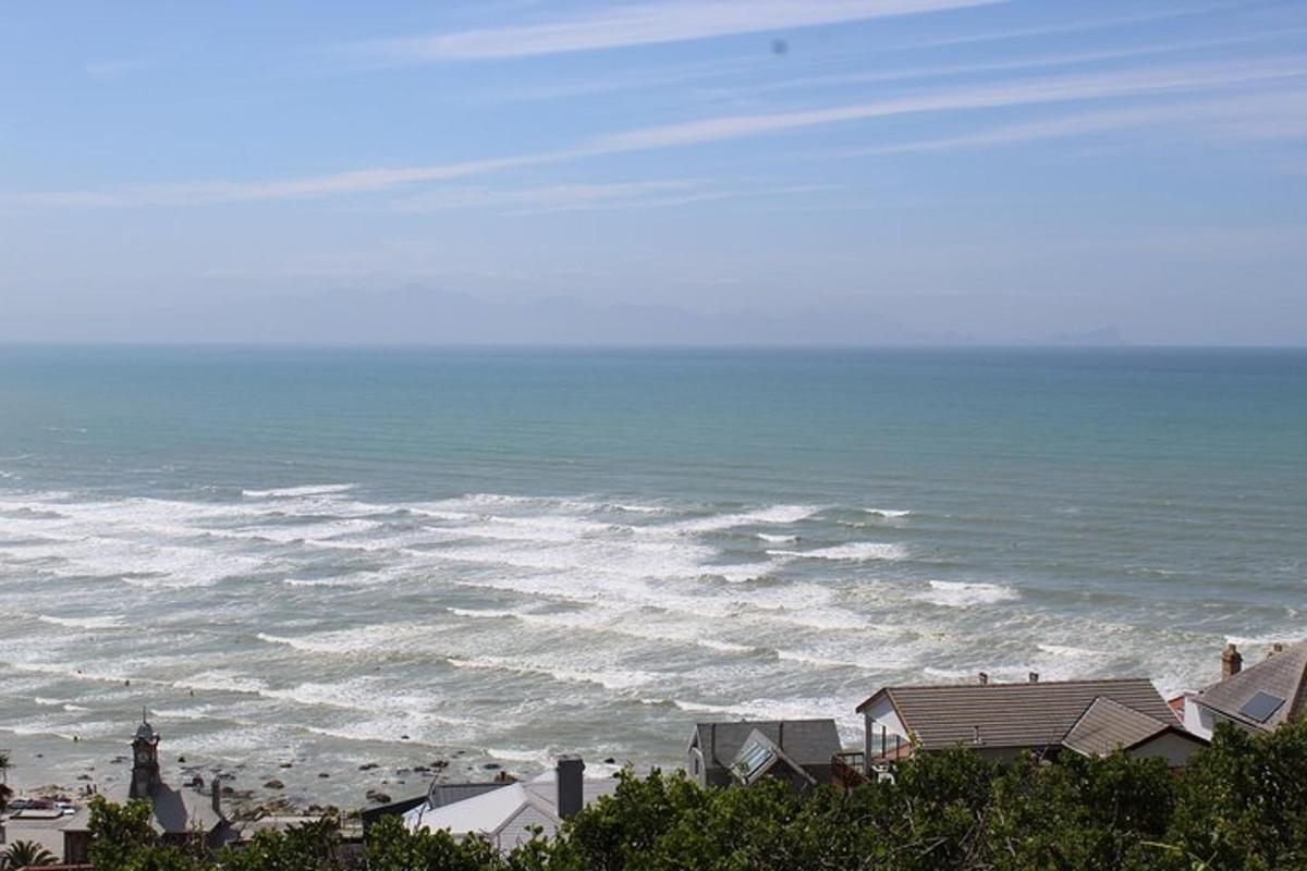a view of the ocean with houses and buildings
