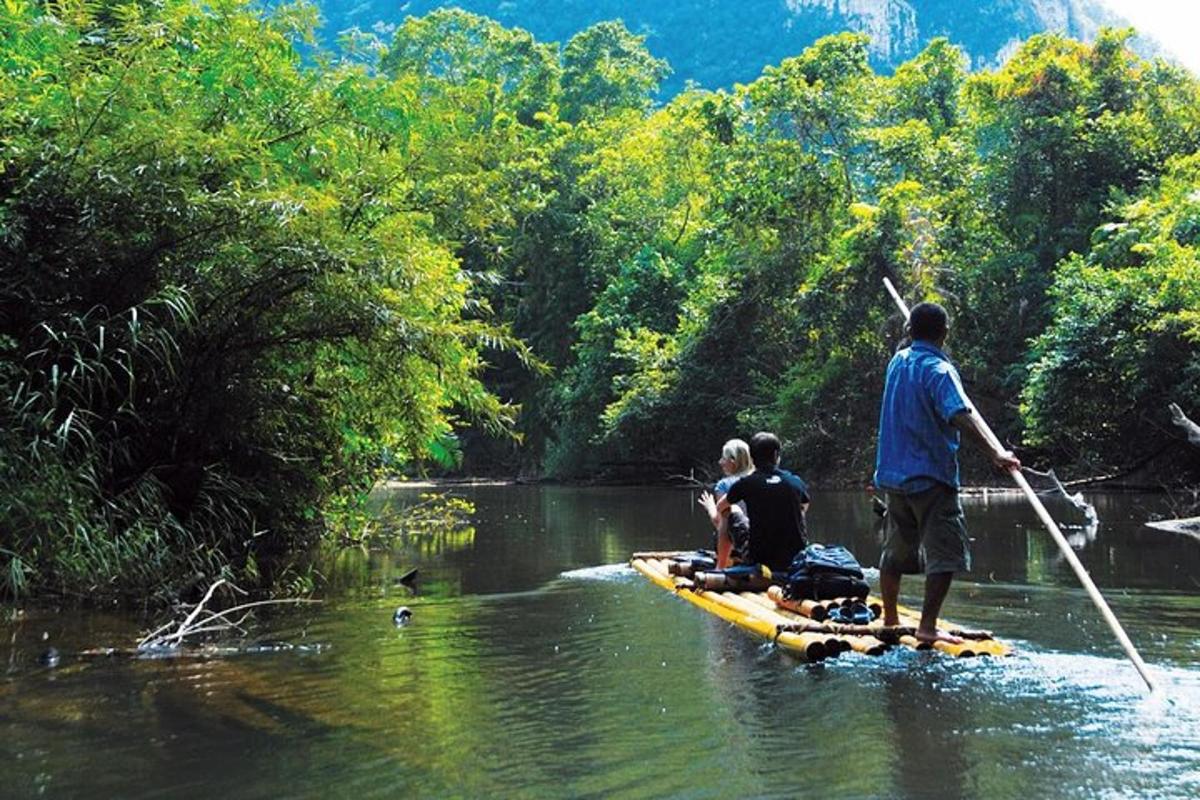 a group of people on a raft on a river