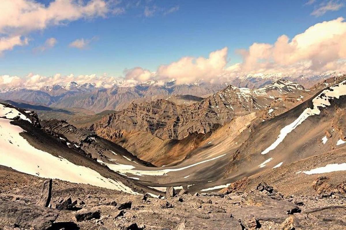 a view of a mountain range with snow covered mountains