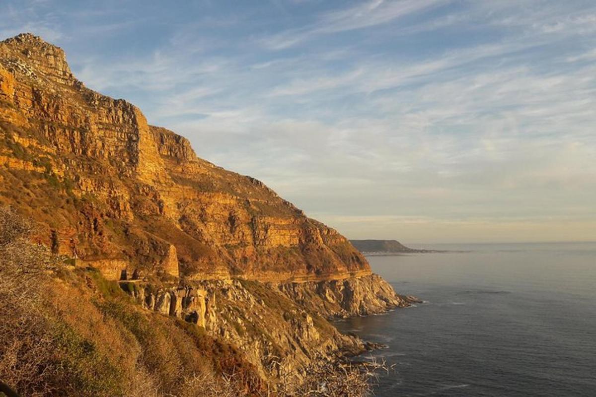 a view of a cliff next to the ocean