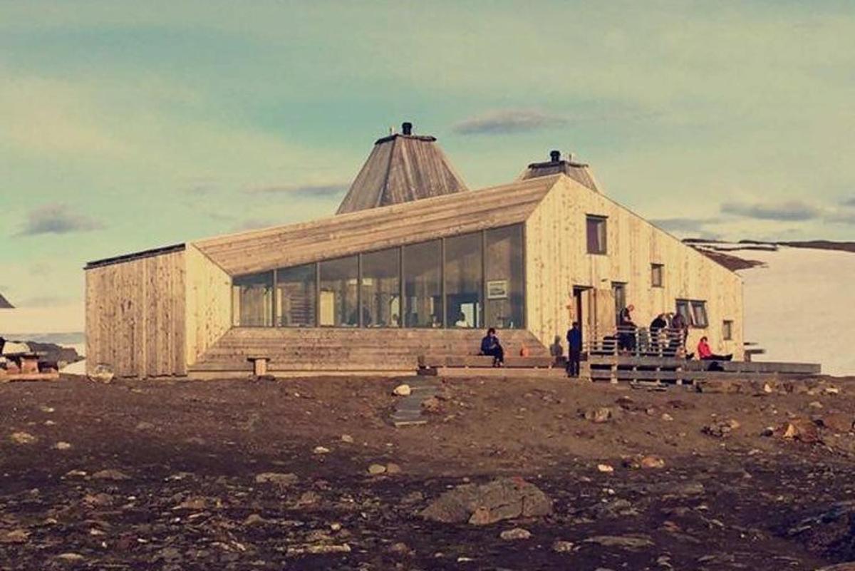 a large building in the middle of a field