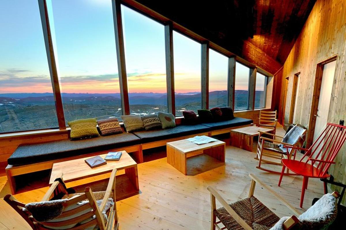 a living room with a couch in a room with windows
