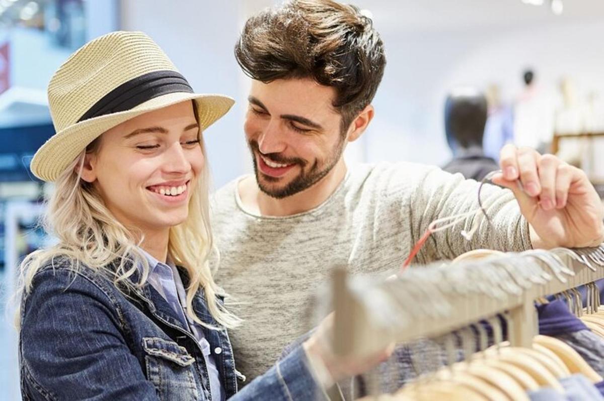 a man and woman looking at a display in a store