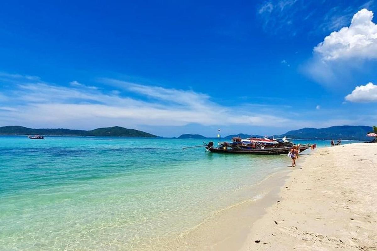 a boat in the water on a beach