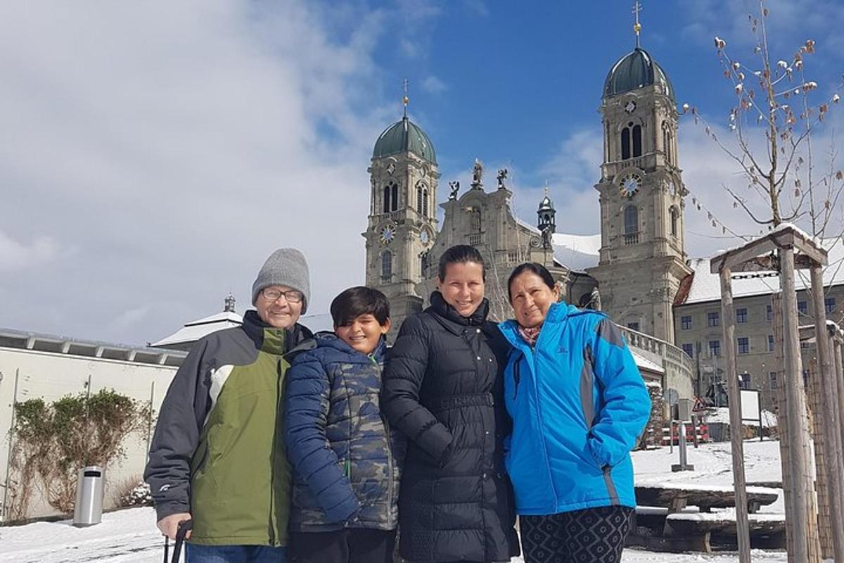 a group of people posing in front of a church
