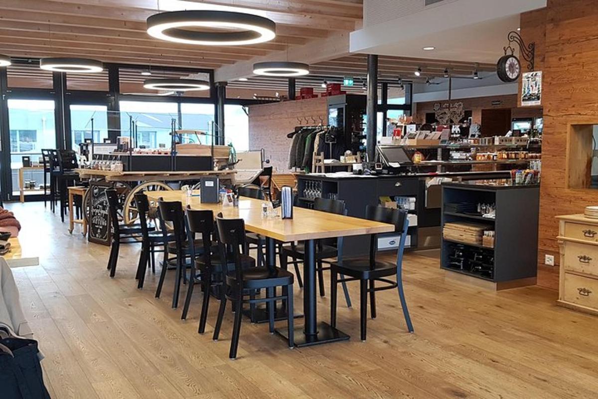 a restaurant with wooden tables and chairs in a room