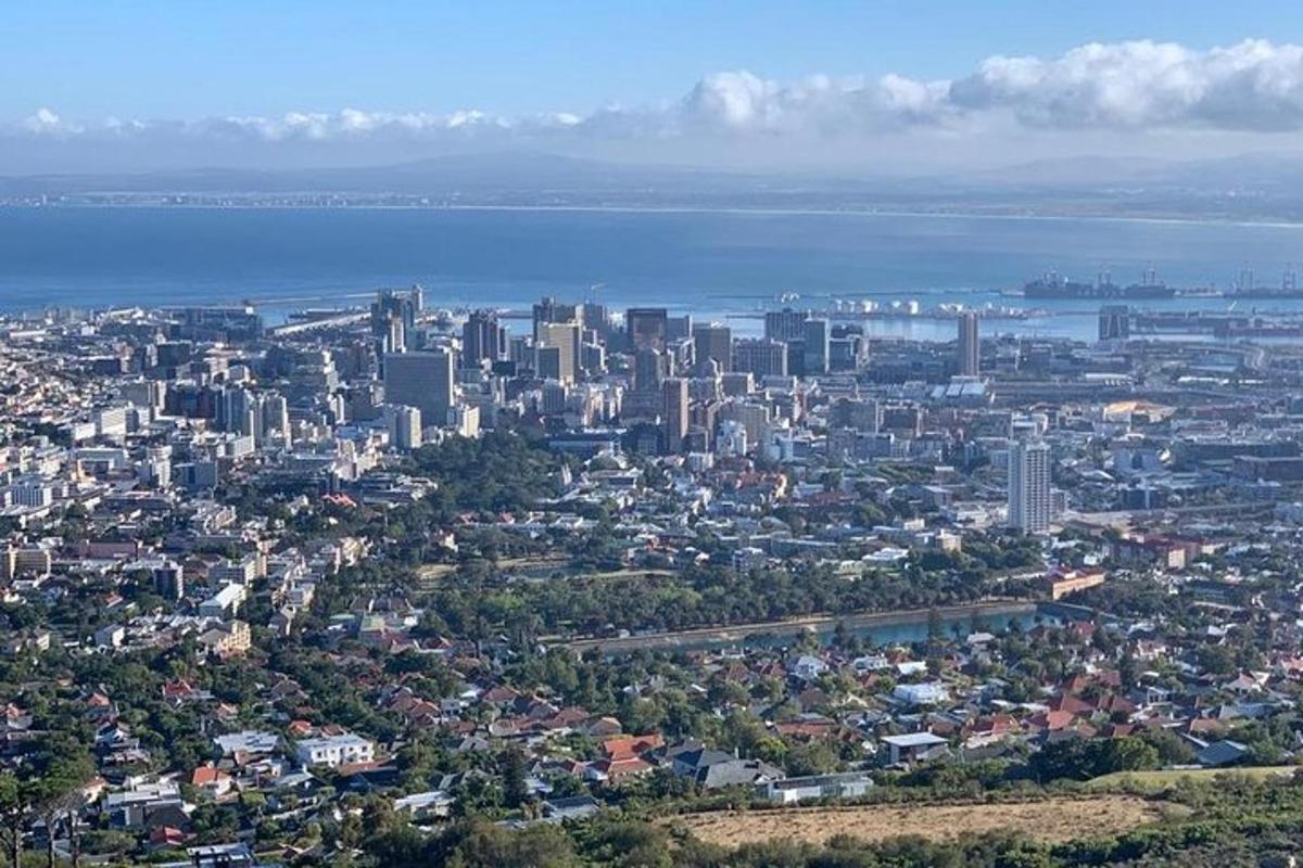 an aerial view of a city with the ocean