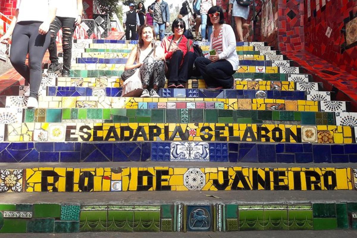 a group of people sitting on the stairs of a building