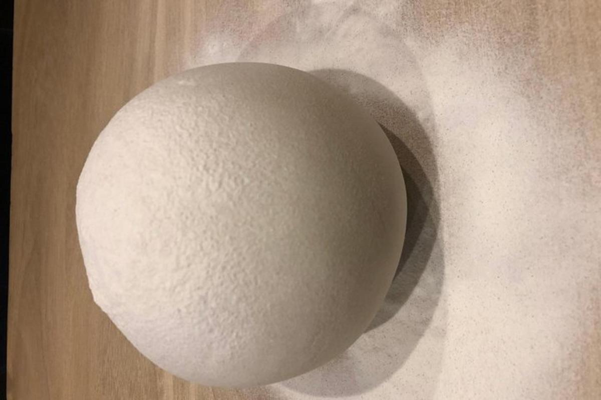 a white egg sitting on top of a table