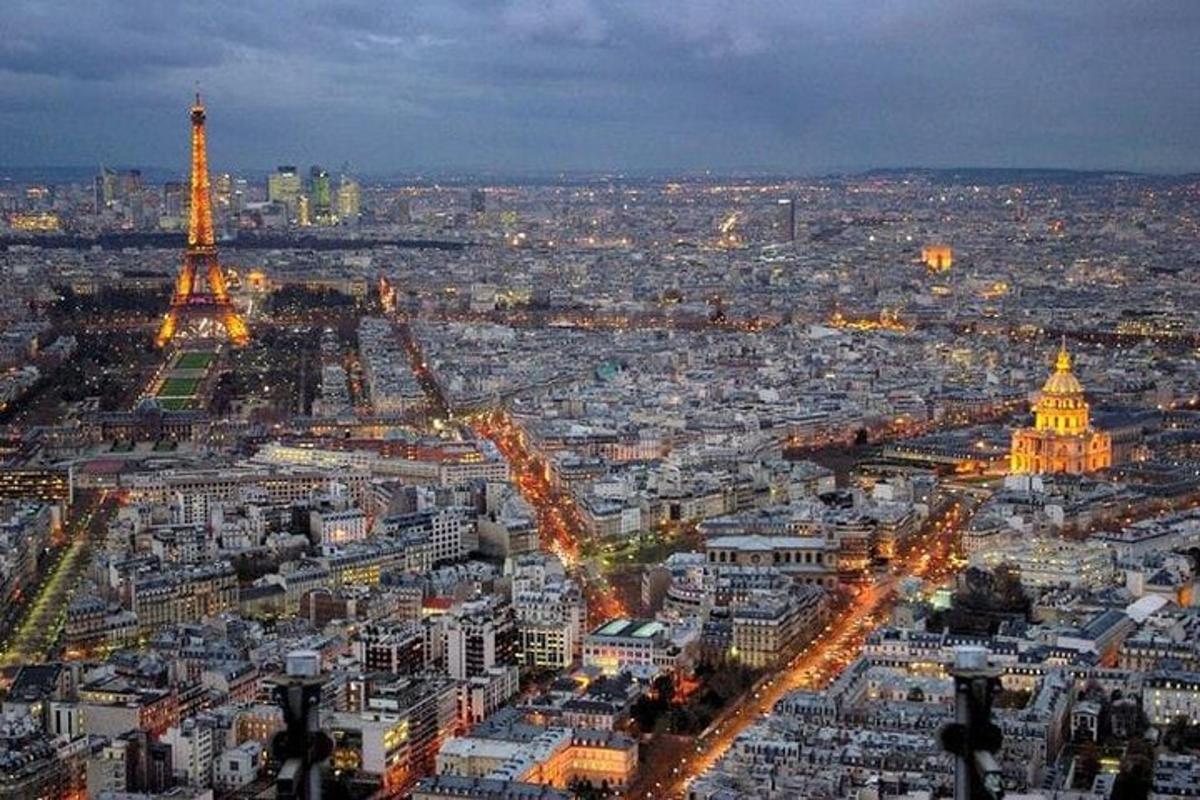 a view of a city at night with the eiffel tower