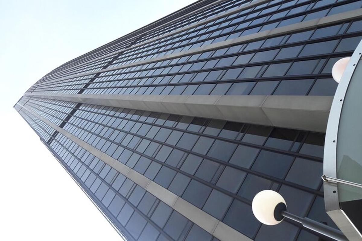 a tall glass building with a lot of windows