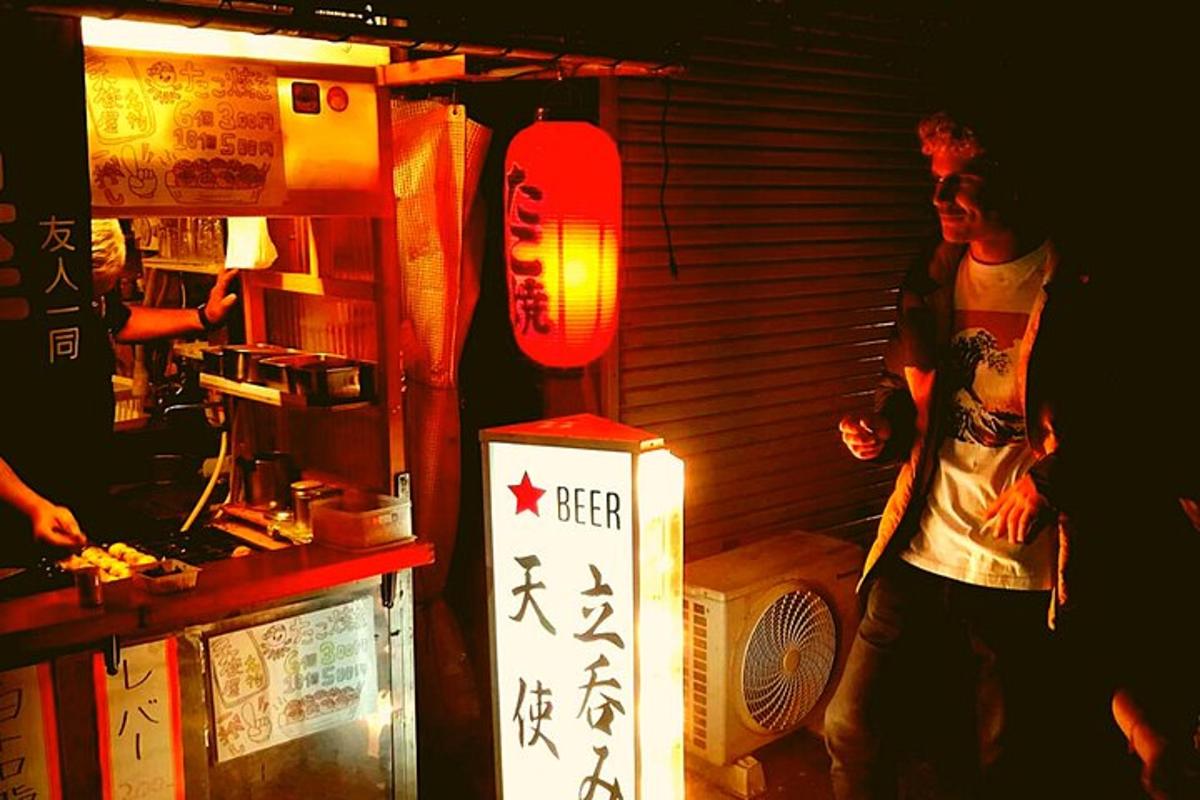 a man standing in front of a counter in a kitchen