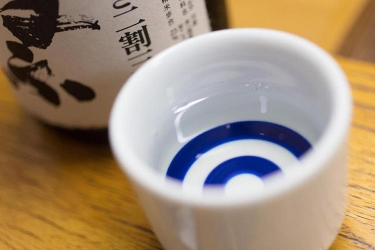 a close up of a white cup on a table