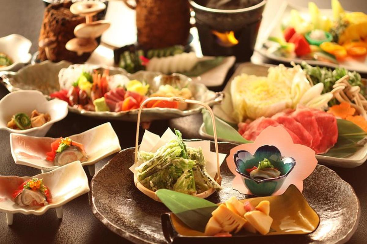 a table topped with plates of different types of food