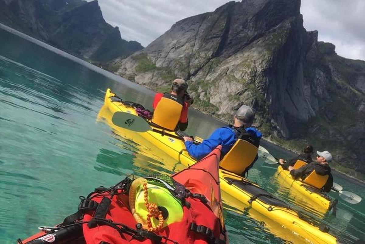a group of people in kayaks in the water