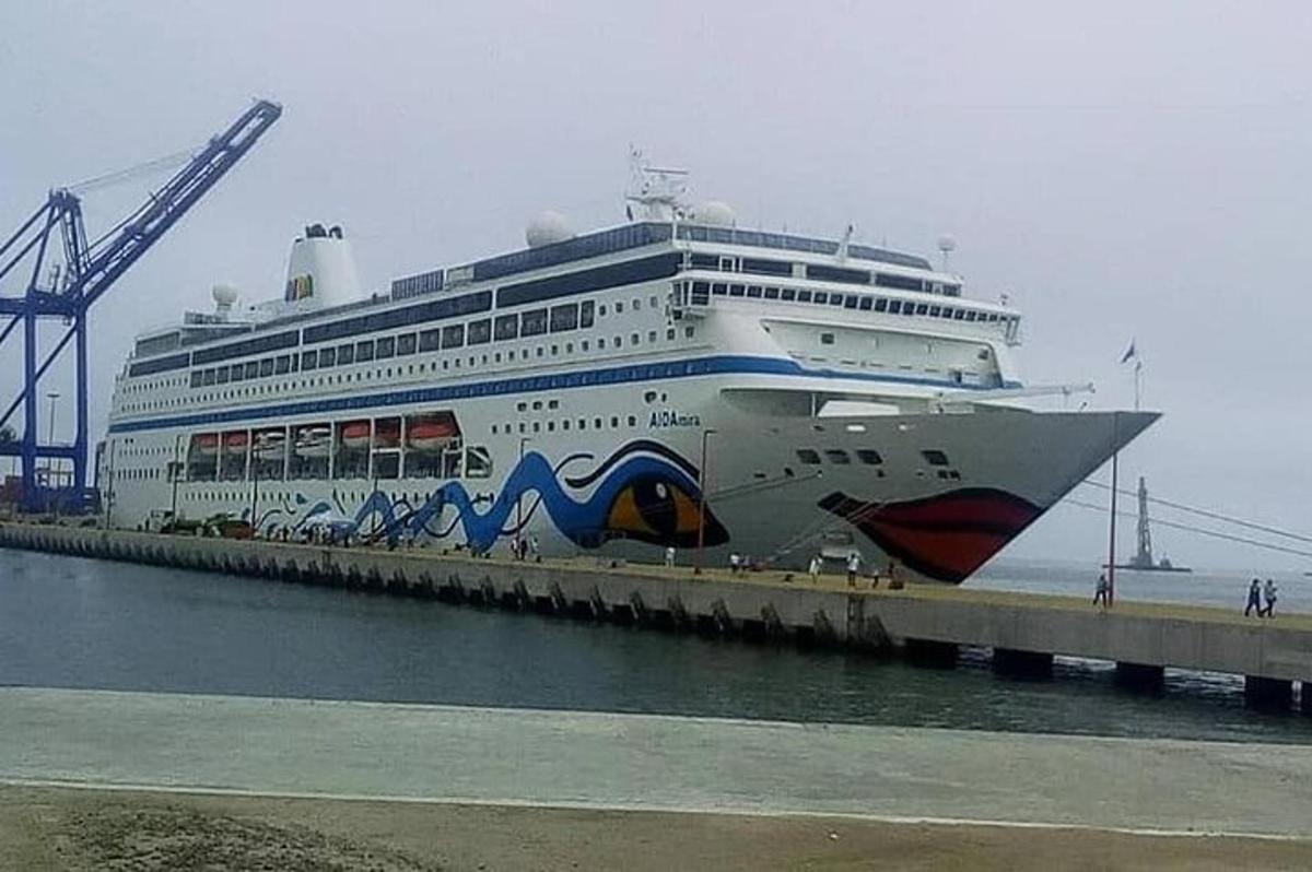 a cruise ship is docked at a dock