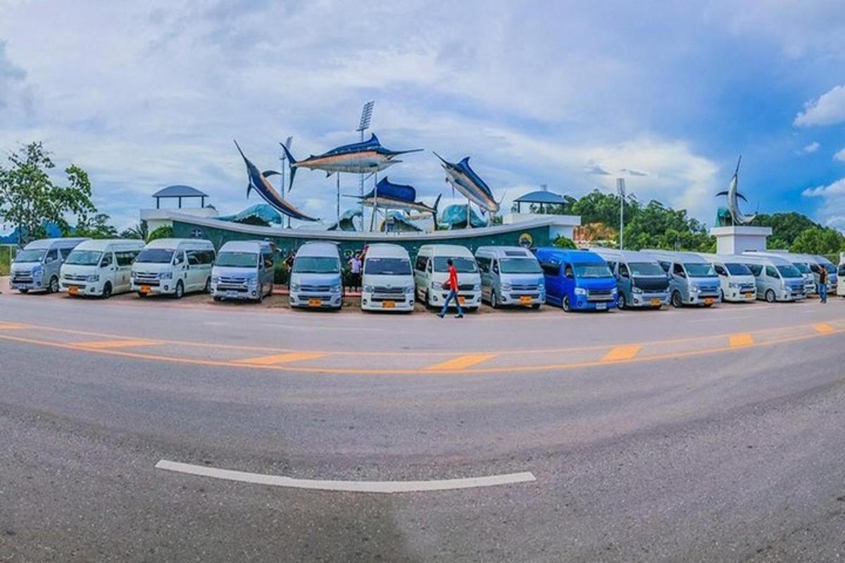a row of cars parked in a parking lot