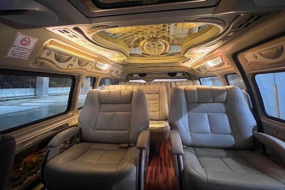 a bus with two seats in the back of it