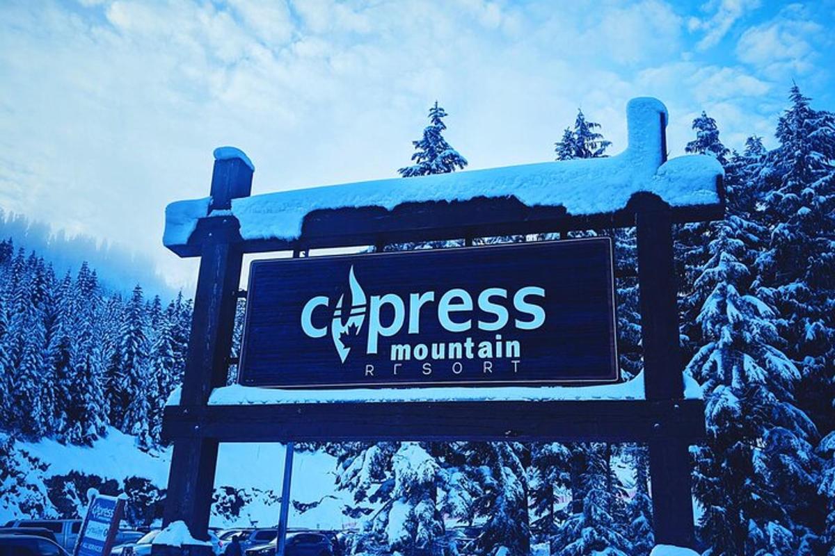 a sign for a ski resort with snow on it