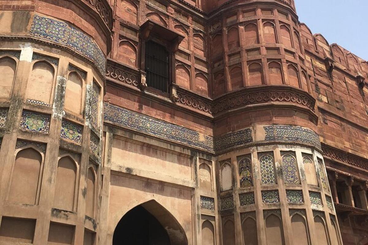 an old building with a window and an archway