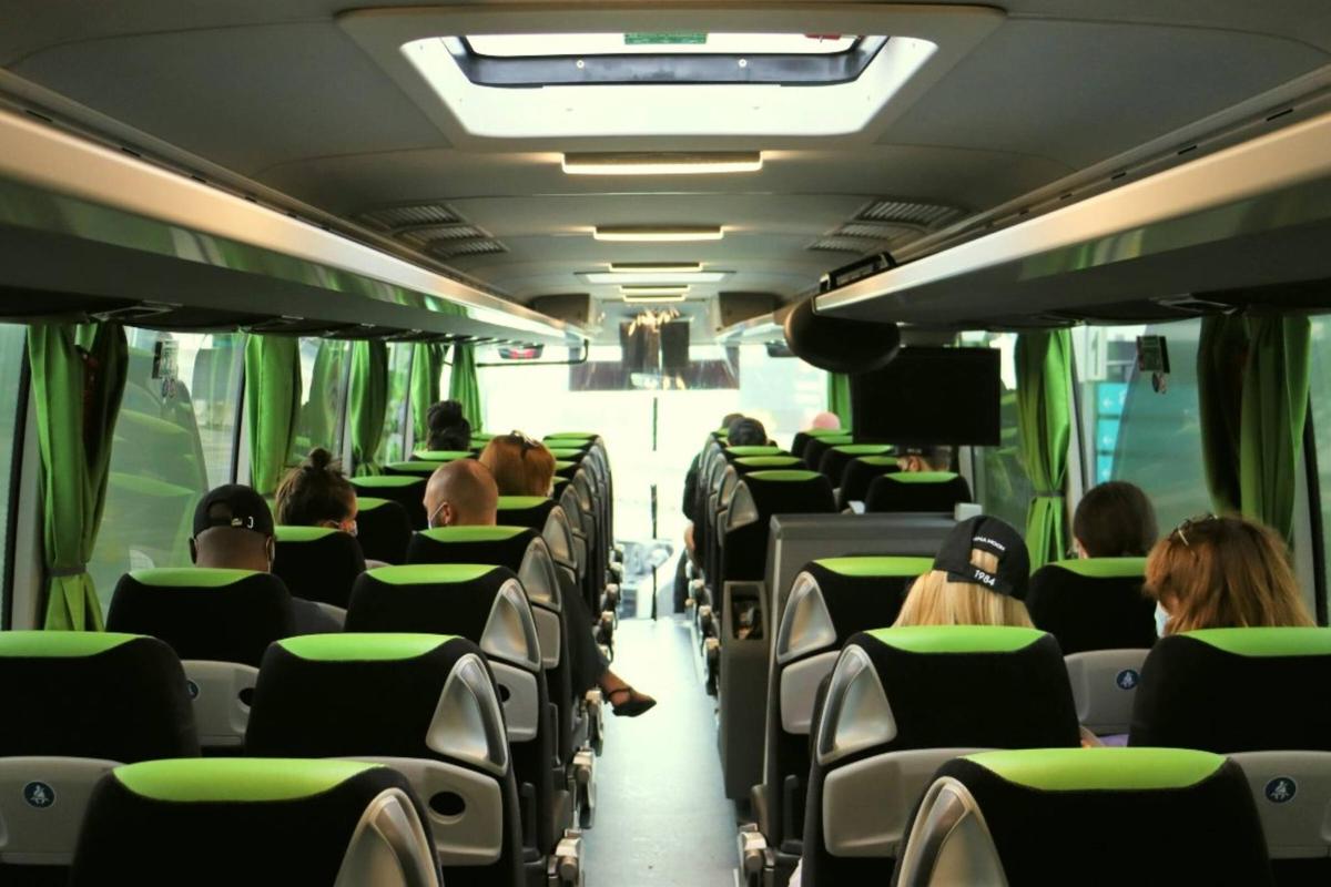 a group of people sitting on a bus