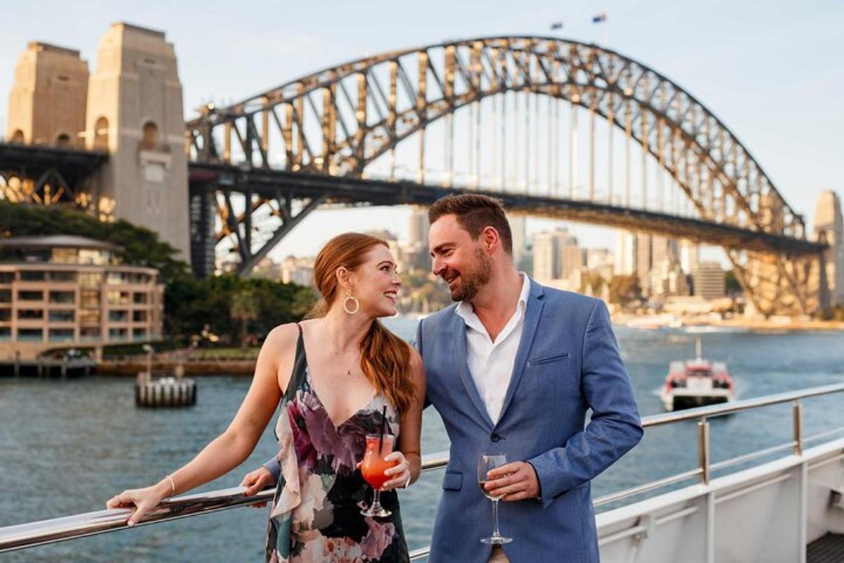 a man and a woman standing in front of a bridge