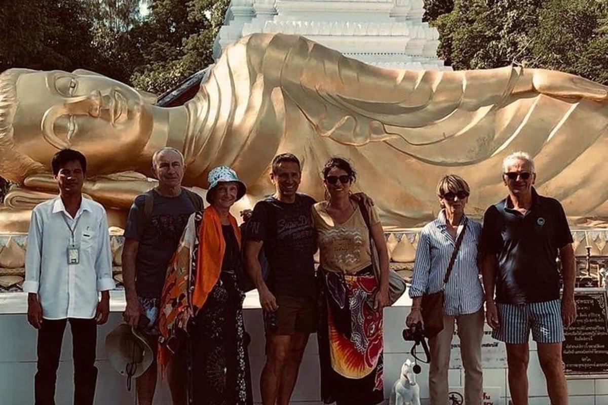 a group of people standing in front of a statue
