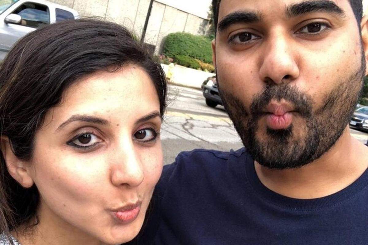 a man and a woman posing for a picture