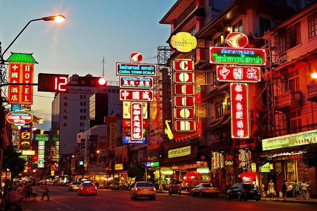 a busy city street with many neon signs