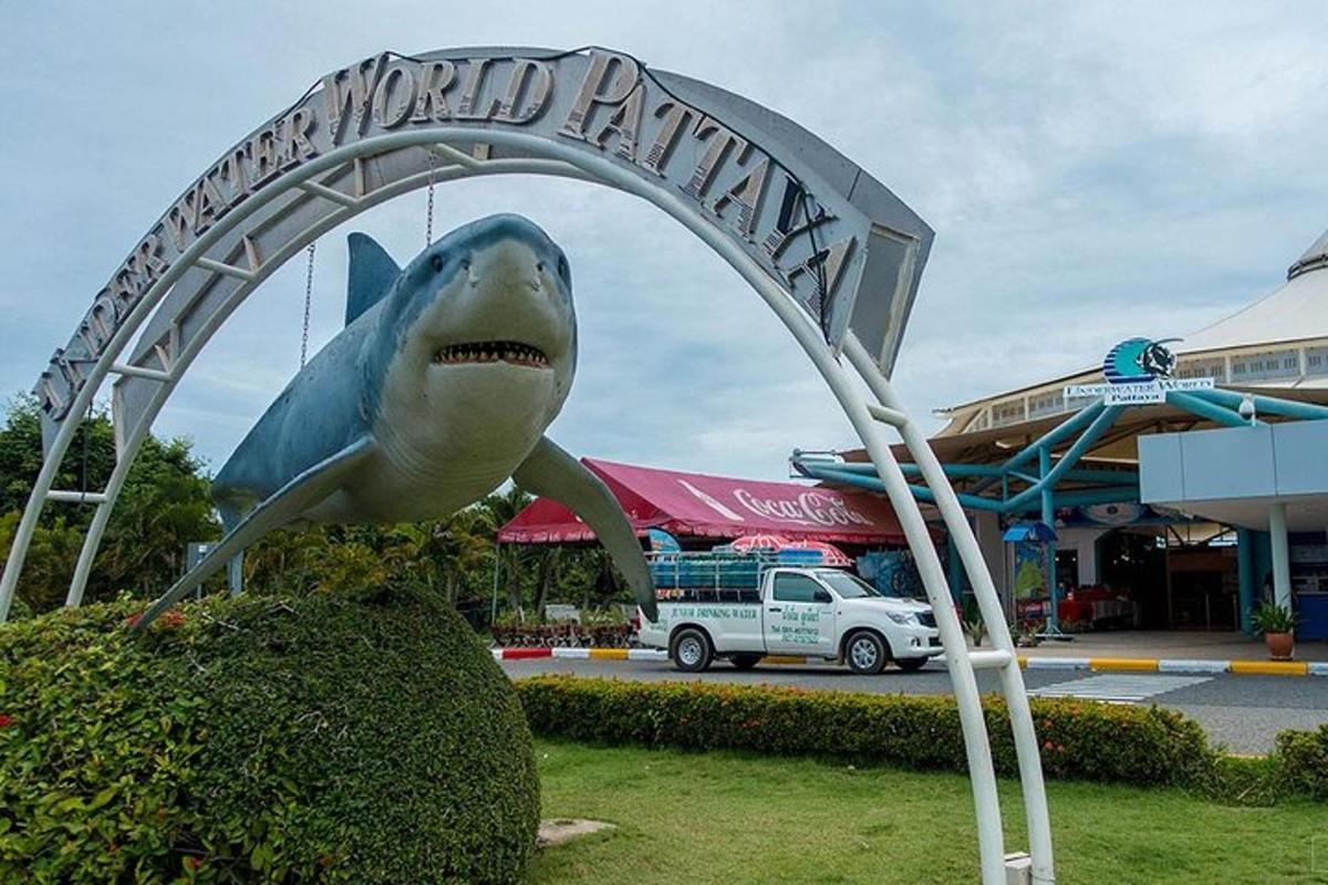 a statue of a shark sticking out its tongue