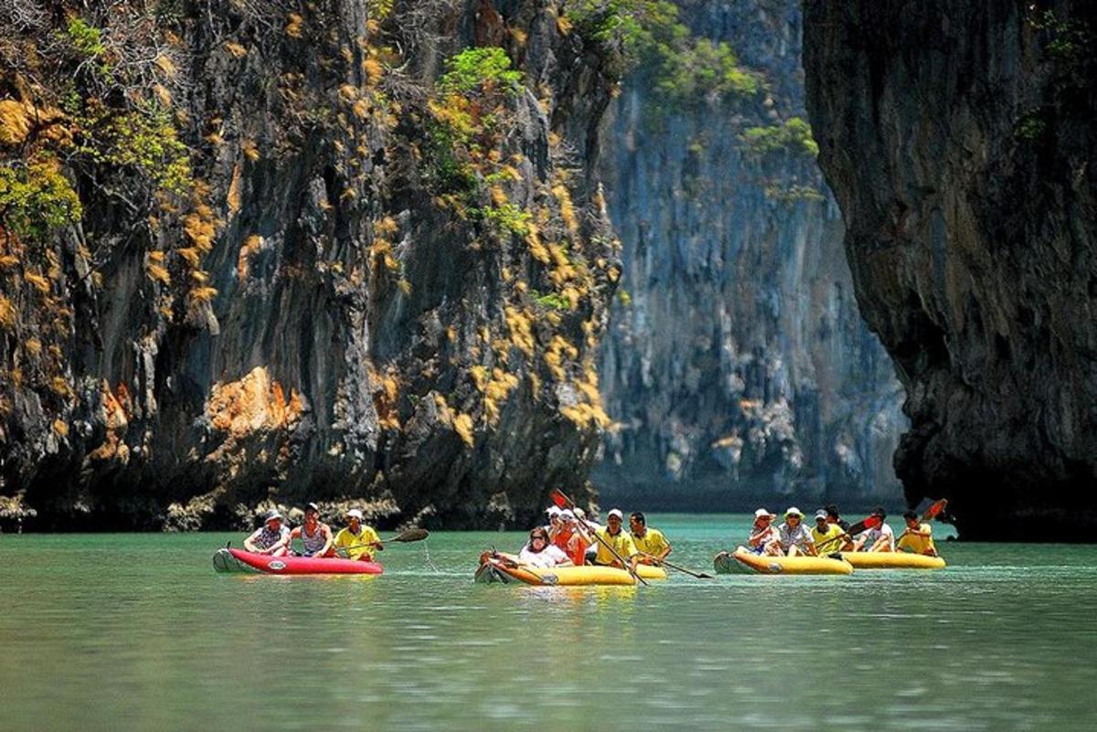 a group of people riding on kayaks in the water