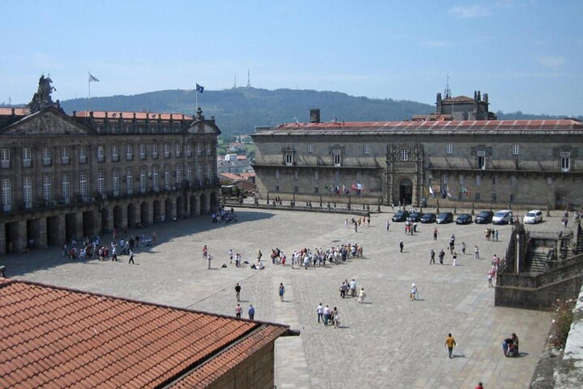 a group of people walking around a large building