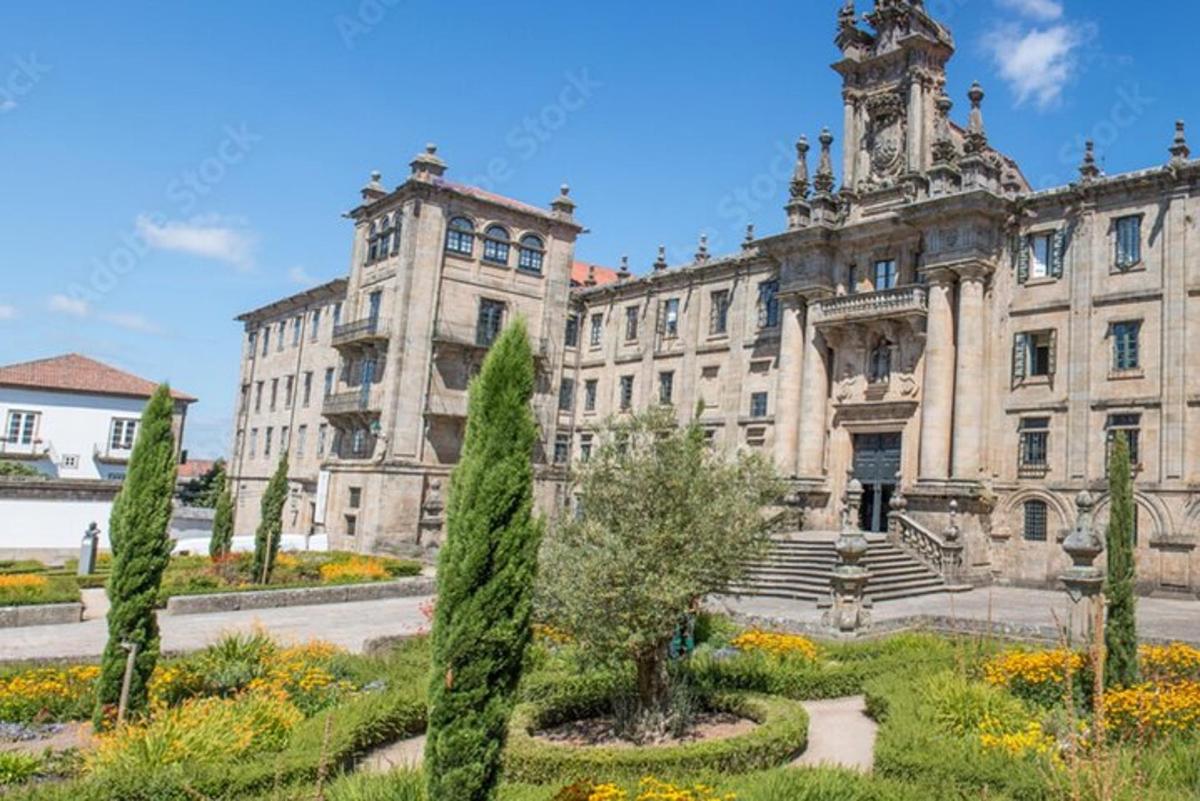 an old building with a garden in front of it