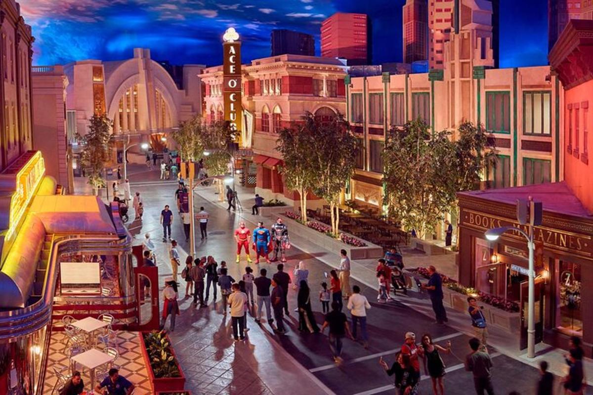 a group of people walking down a city street