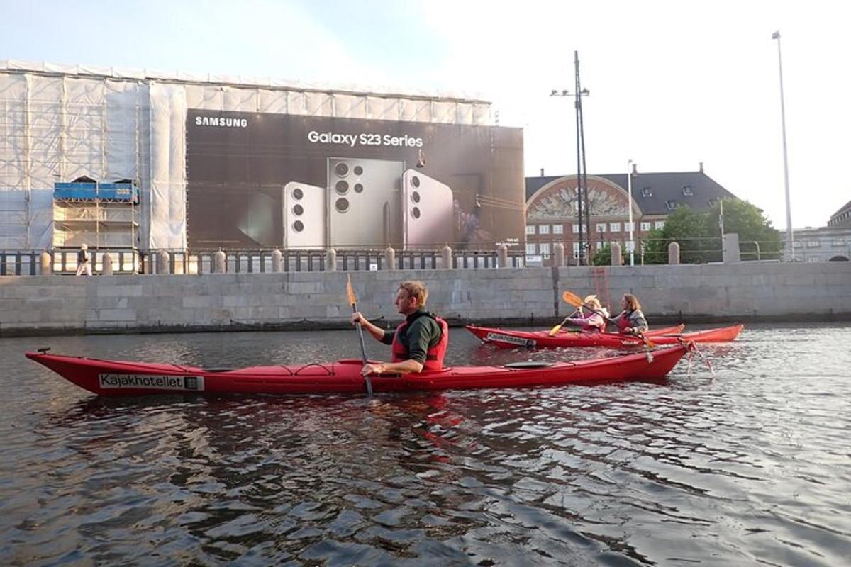 a group of people in kayaks in the water