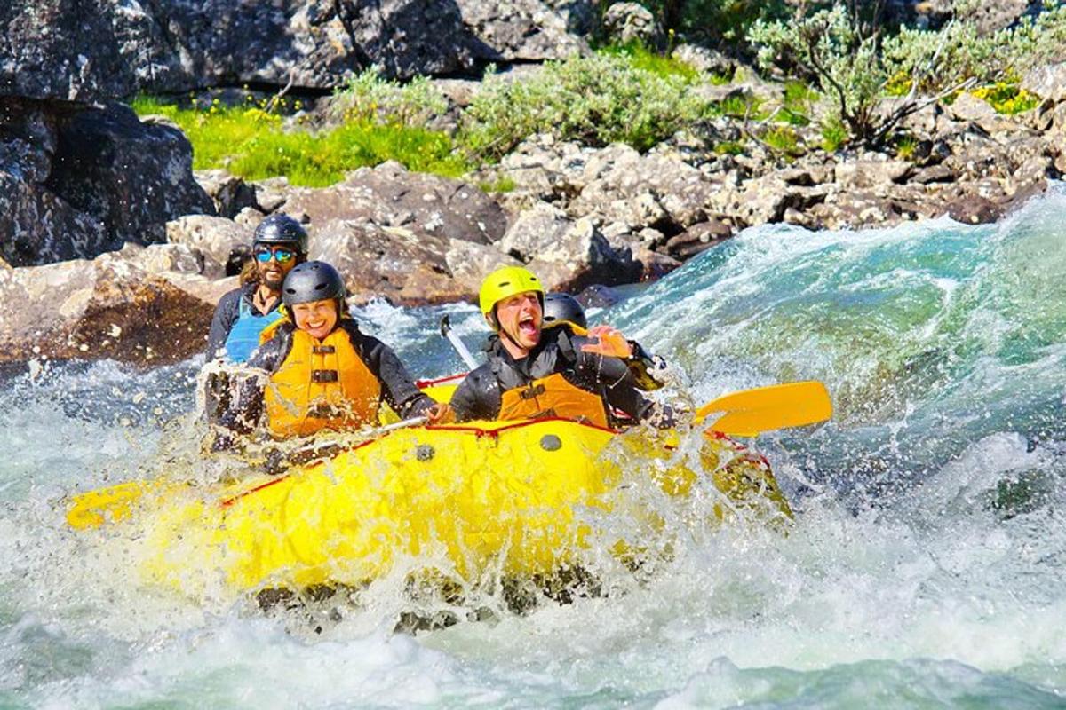 a group of people in a raft on a river