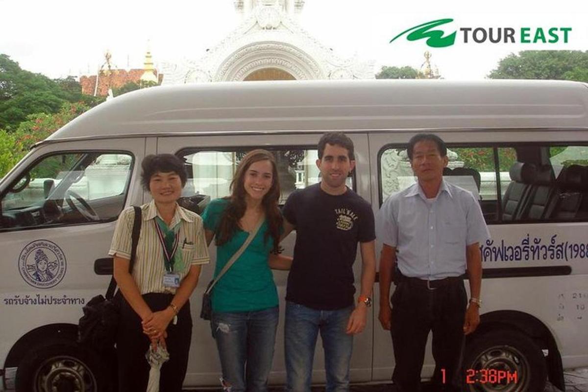 a group of people standing in front of a van