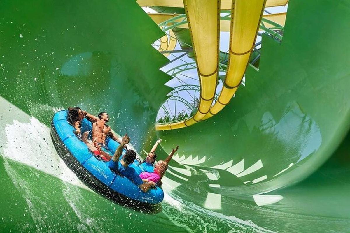 a group of people riding a raft in a roller coaster