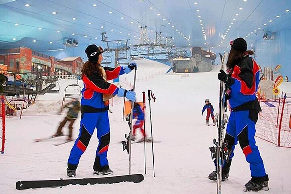 two people are standing on a ski slope
