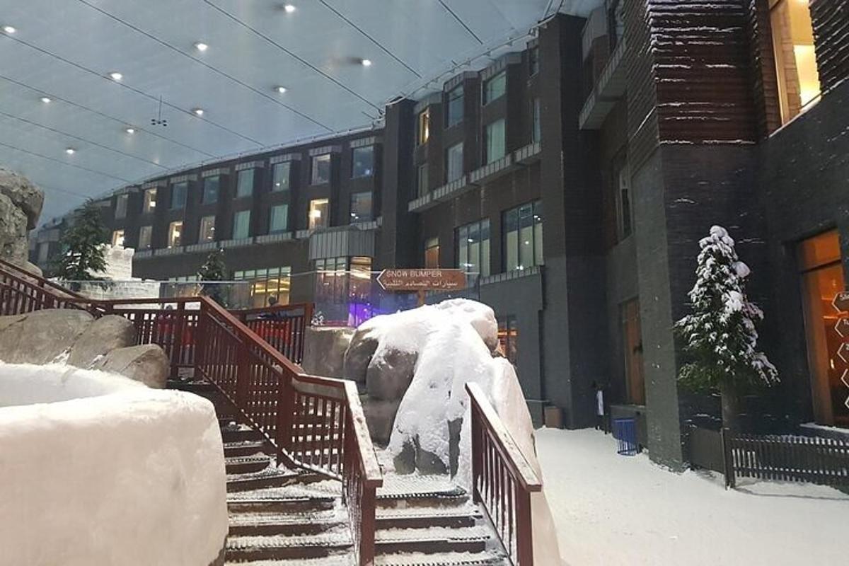 a snow covered staircase in front of a building