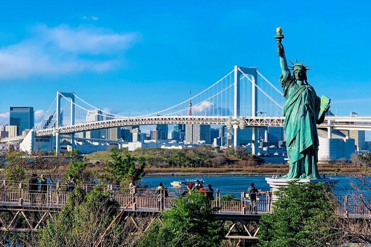 a statue of liberty with a bridge in the background