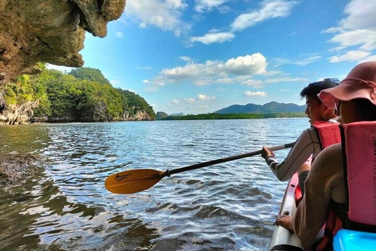 two people in a paddle boat on a lake