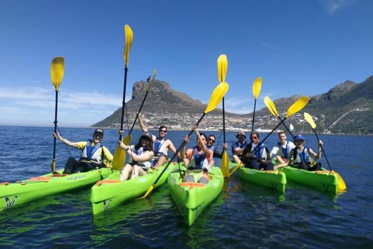 a group of people in kayaks in the water
