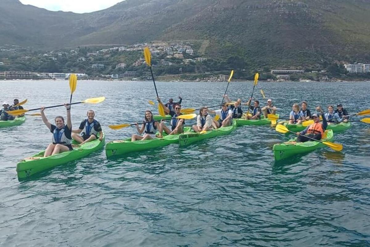 a group of people in kayaks in the water