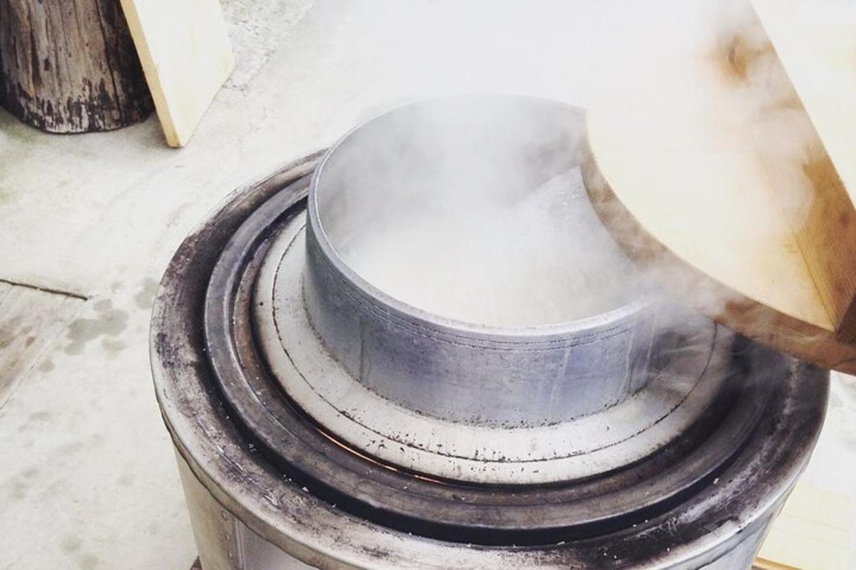 a person is grinding a metal bucket on the floor