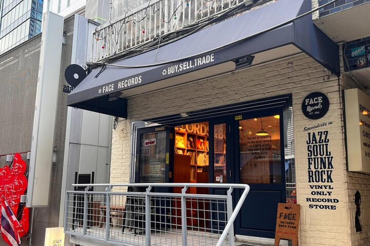 a store with a blue awning on a building