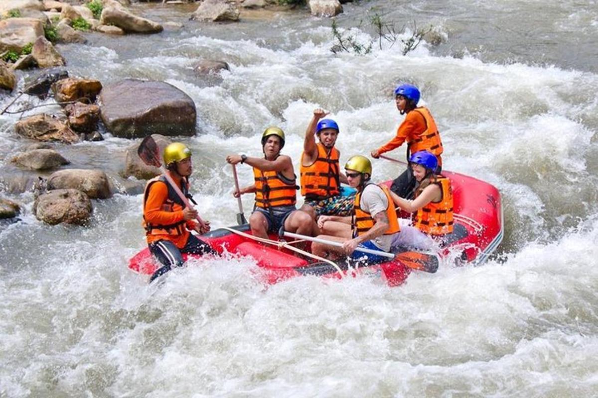 a group of people on a raft in a river